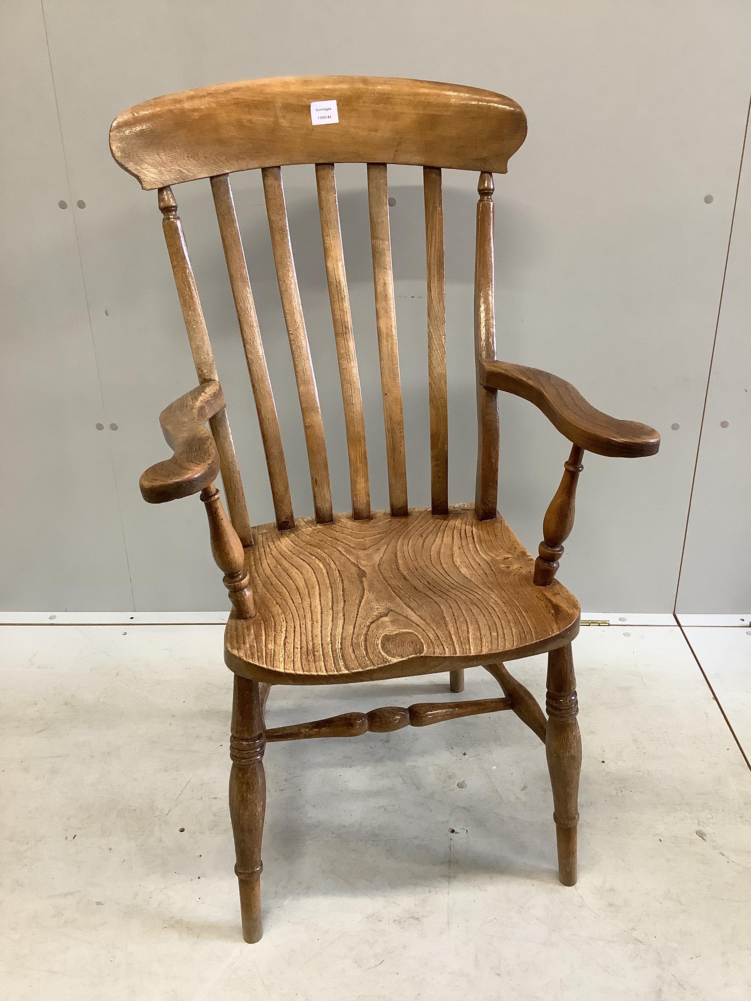 A Victorian elm and beech Windsor lathe back armchair, width 62cm, depth 43cm, height 112cm